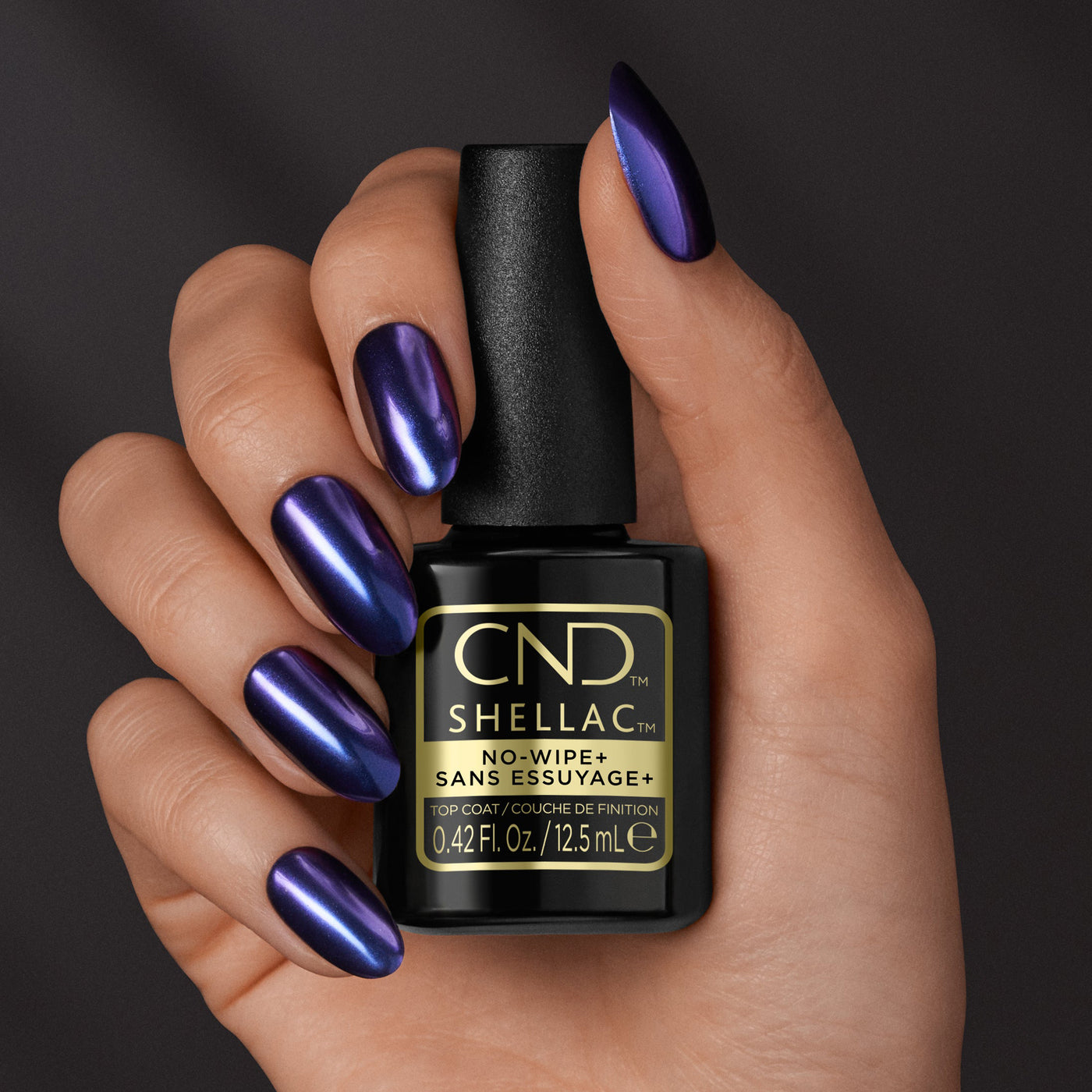 CND Shellac No-Wipe+ Top Coat (12.5ml) as held by model