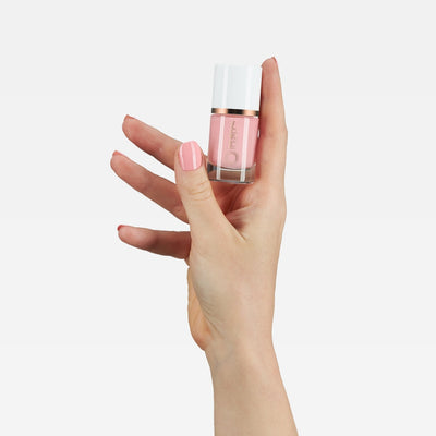 Mineral Fusion Nail Polish 220 Pretty in Pink (10ml) with model's hand and swatch on nail